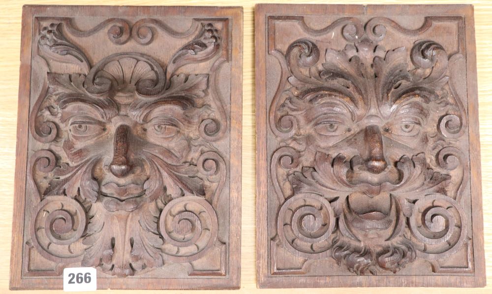 A pair of carved wall lion masks, width 23cm height 28cm
